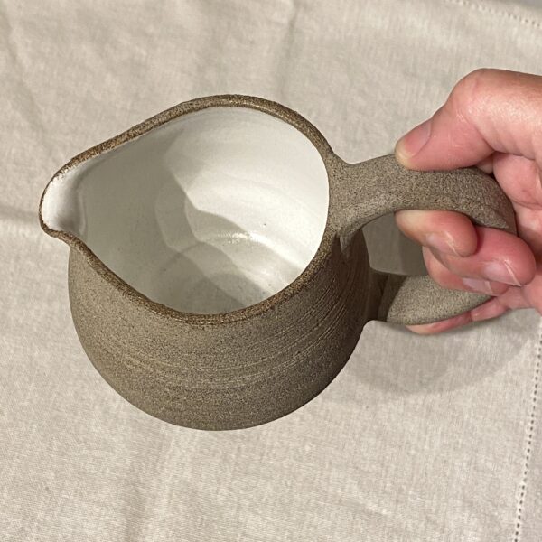 hand-held clay pitcher
